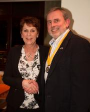 Sandra is welcomed into the club by President Elect Alan
